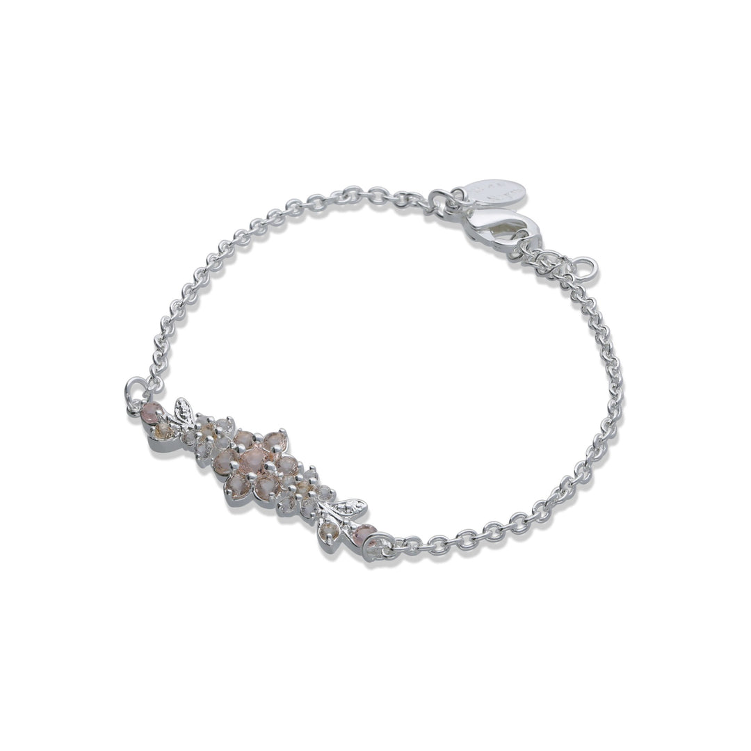 A medium flowering branch bracelet studded with champagne colored crystal stones