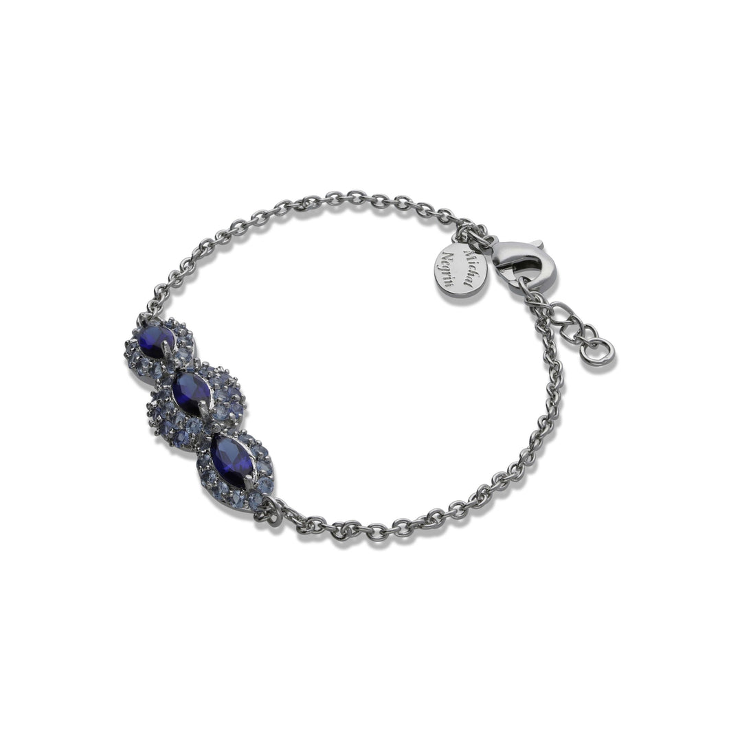 A marquise-shaped eye bracelet studded with blue crystal stones