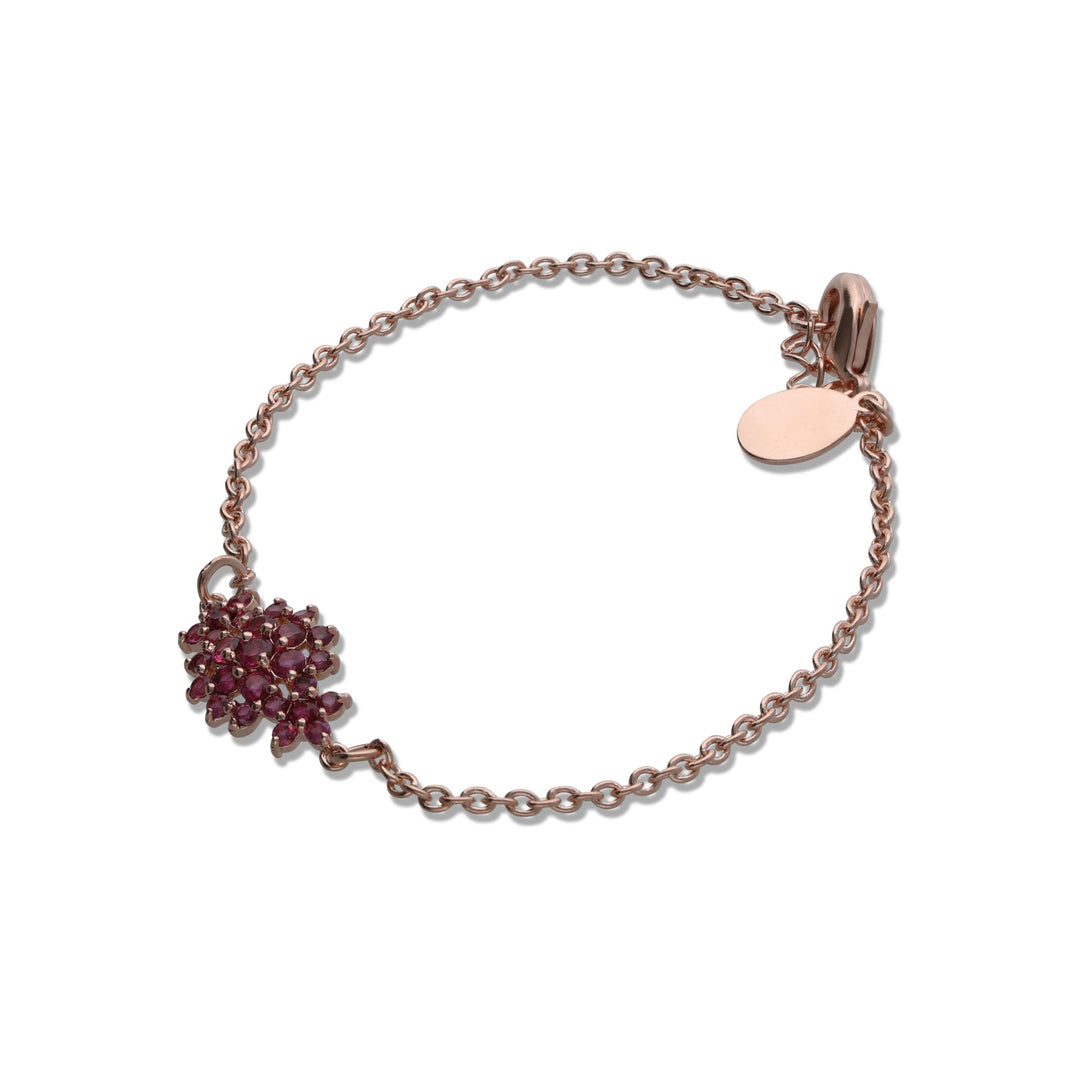 A floral rhombus bracelet studded with ruby ​​colored crystals