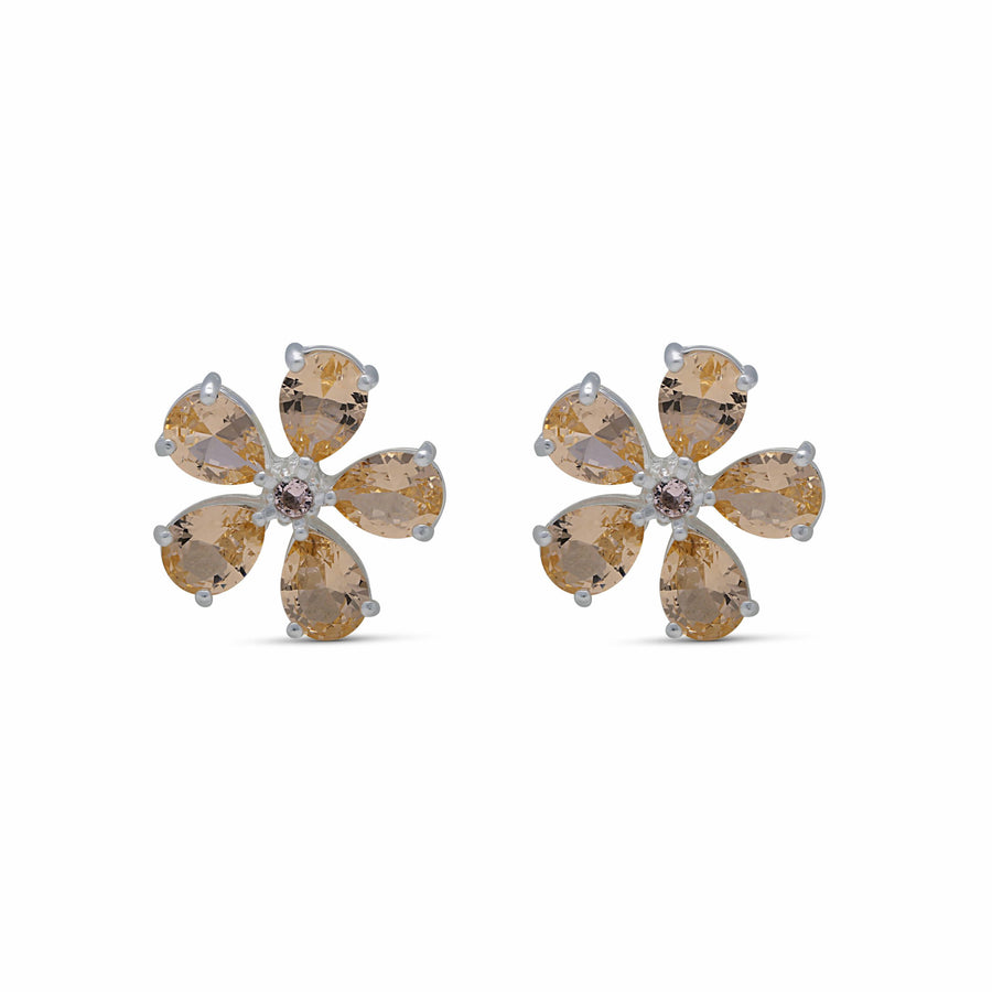 Close-up earrings with a wish flower studded with champagne-colored crystal stones
