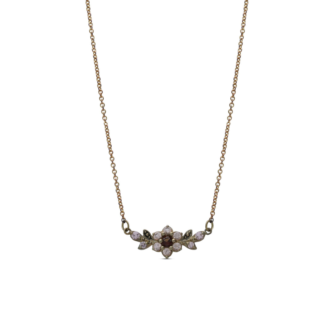 A short flowering branch necklace studded with cream garnet colored crystal stones