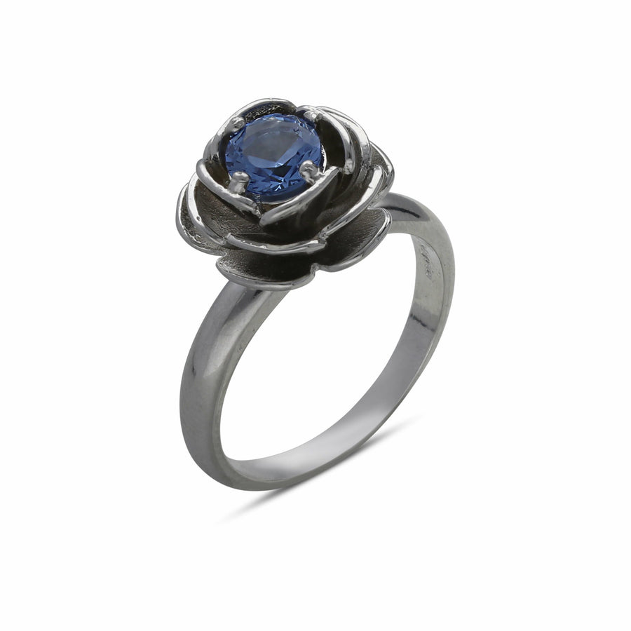 Rose ring studded with a blue crystal stone