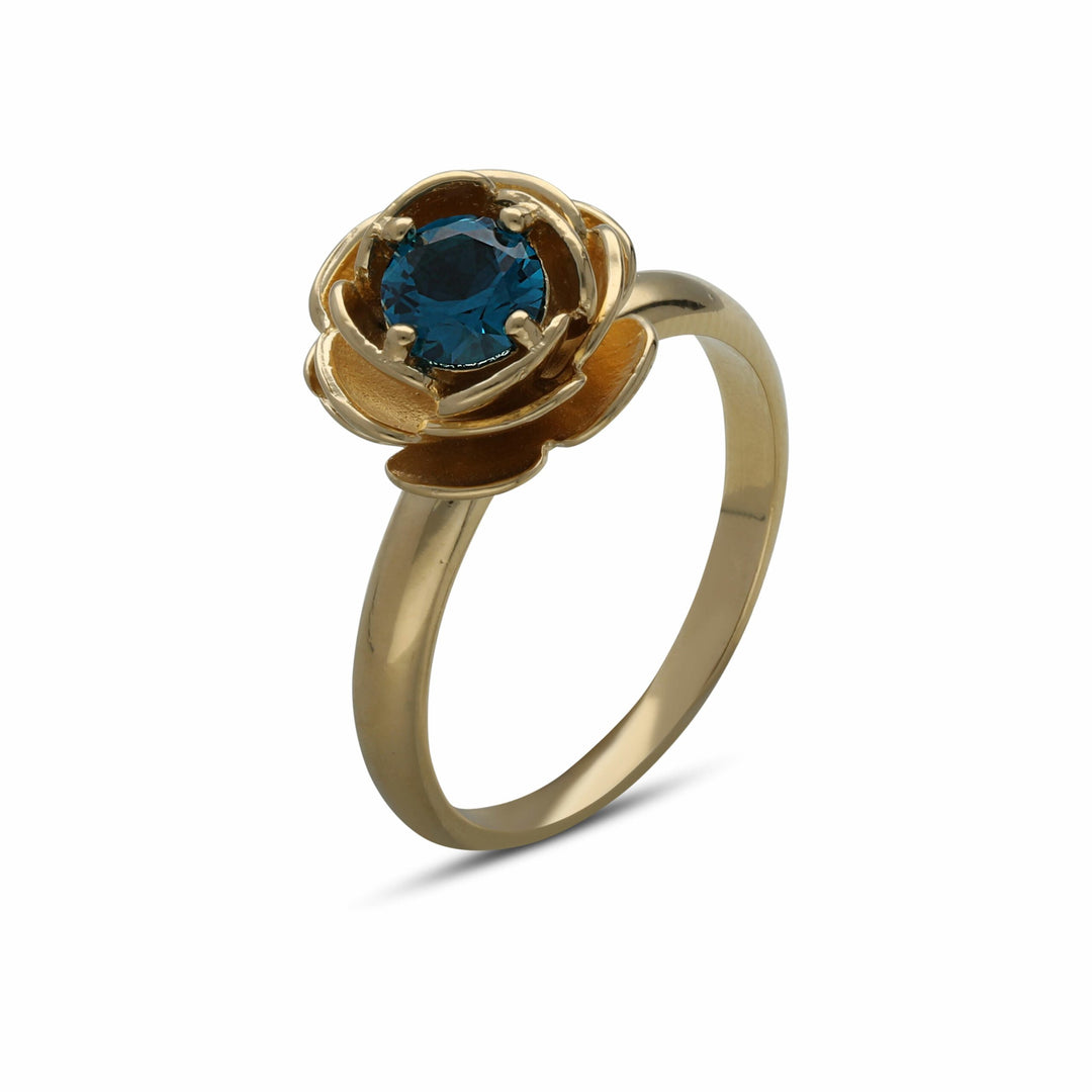 Rose ring studded with a turquoise crystal stone