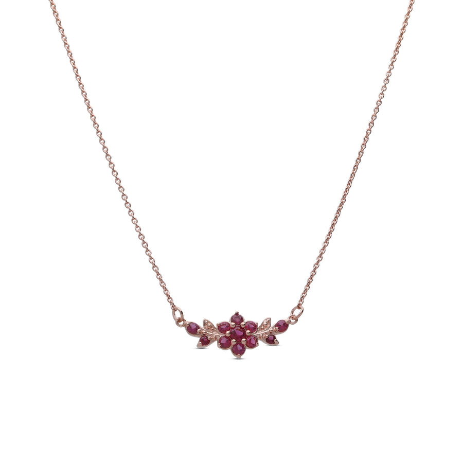 A short flowering branch necklace studded with ruby colored crystal stones