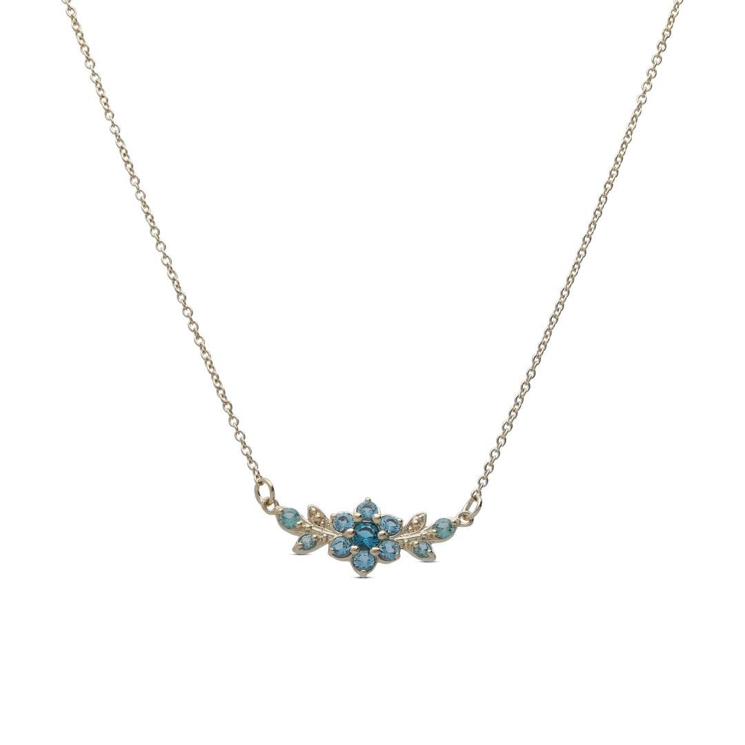 A short flowering branch necklace studded with turquoise crystal stones