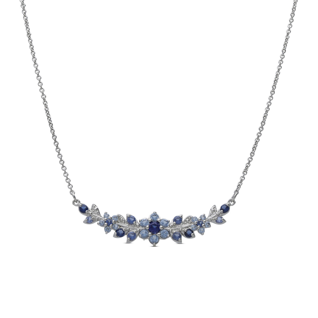 A long flowering branch necklace studded with blue crystal stones