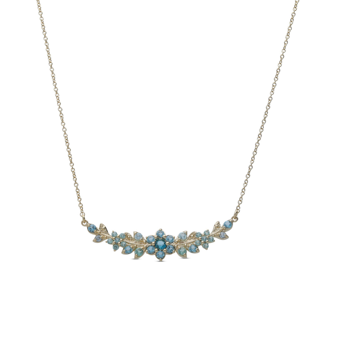 A long flowering branch necklace studded with turquoise crystal stones
