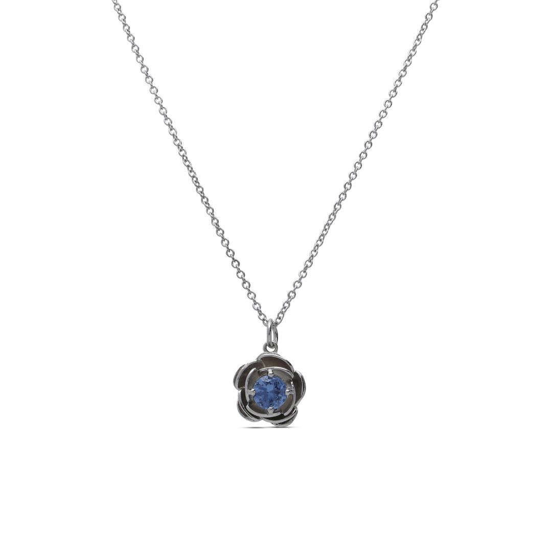 Rose necklace set with a blue crystal stone