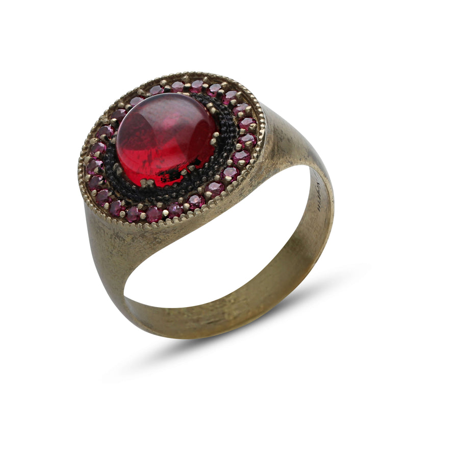 Light beam ring studded with ruby colored crystal stones