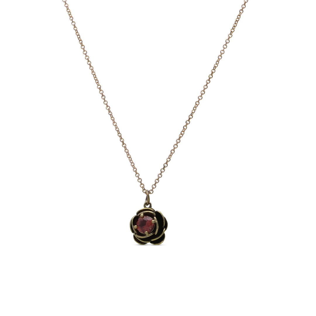 A rose necklace inlaid with a light garnet crystal stone