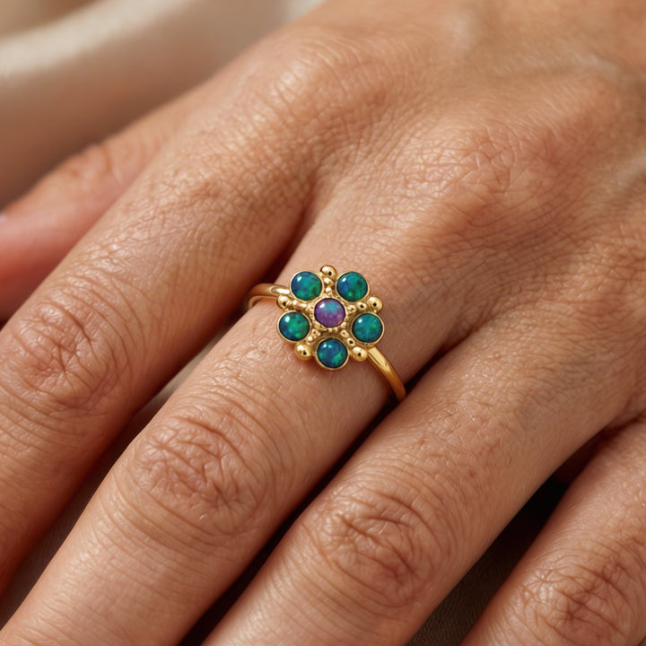Bloom - A flower ring set with blue-purple lab opal stones