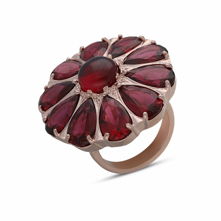 Drop flower ring studded with ruby colored crystal stones