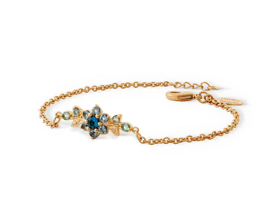 A short flowering branch bracelet studded with turquoise crystal stones