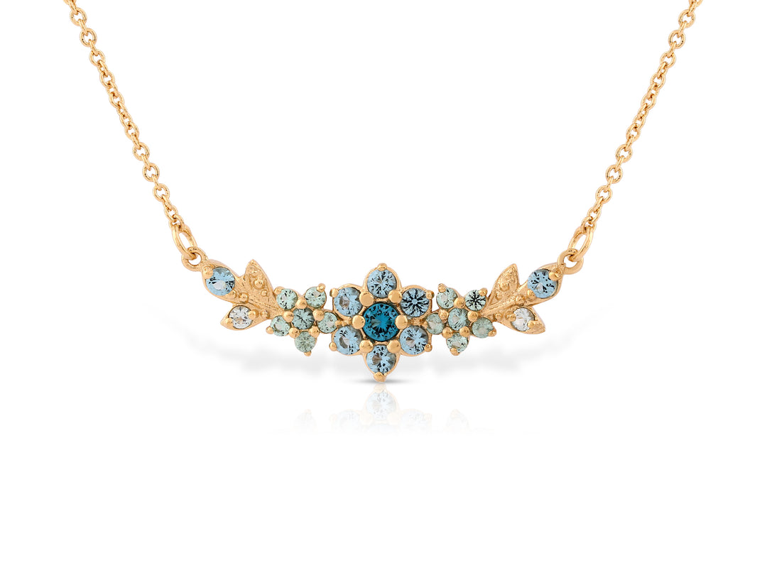 A medium flowering branch necklace studded with turquoise crystal stones
