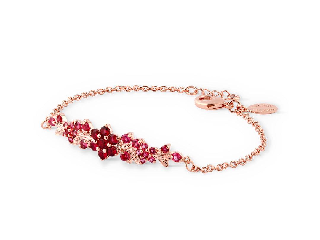 A long flowering branch bracelet studded with ruby ​​colored crystal stones
