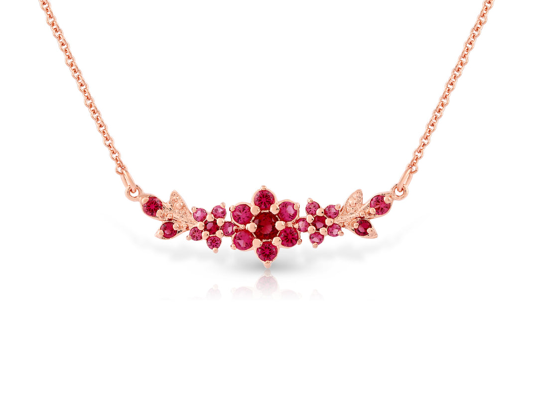 Medium flowering branch necklace studded with ruby ​​colored crystal stones