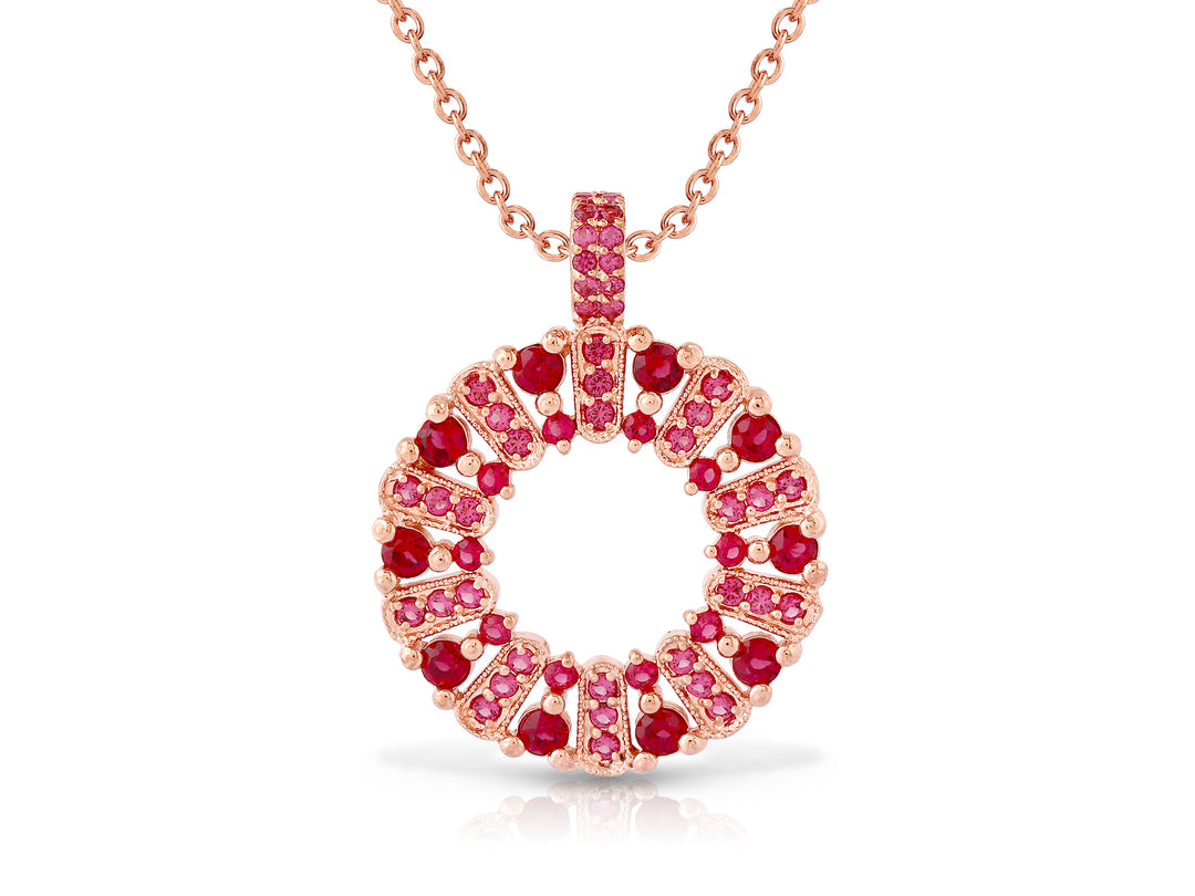 The circle of life necklace is studded with ruby ​​colored crystal stones
