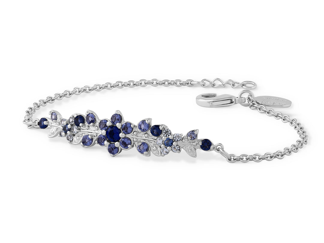 A long flowering branch bracelet studded with blue crystal stones