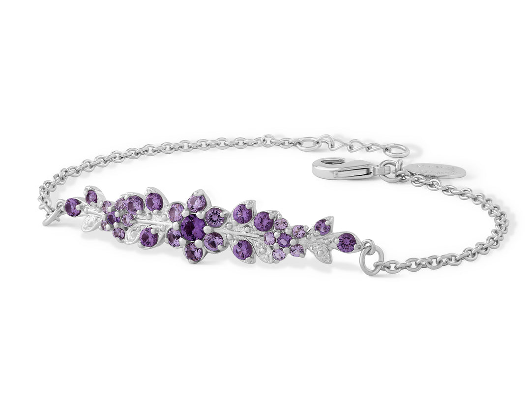 A long flowering branch bracelet studded with purple crystal stones