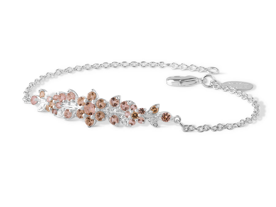 A long flowering branch bracelet studded with champagne colored crystal stones