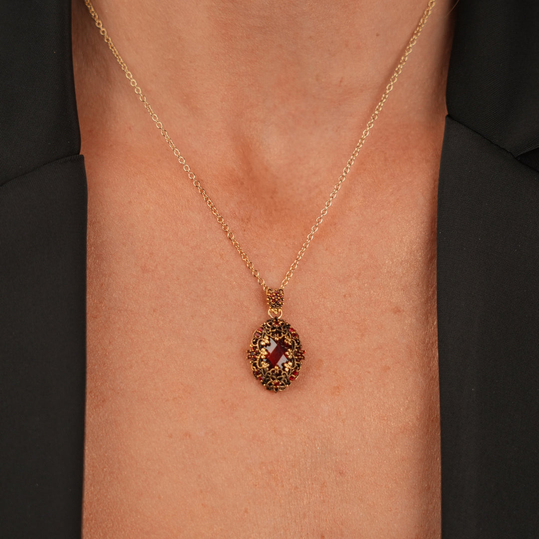 18K gold plated necklace with oval pendant with red zircons M Heritage 