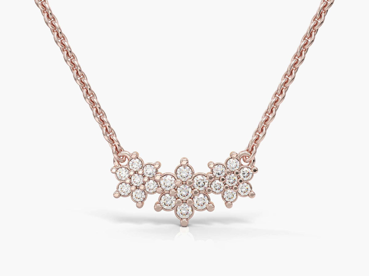 The chain of three adjacent flowers studded with zircons