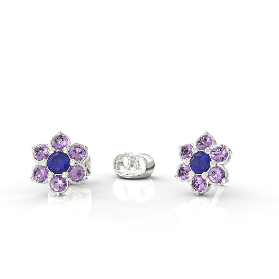 Gold earrings attached to a flowering branch studded with crystal stones 1