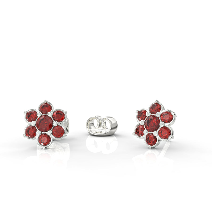 Gold earrings attached to a flowering branch studded with crystal stones 2
