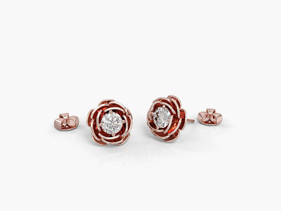 Gold earrings attached to a rose