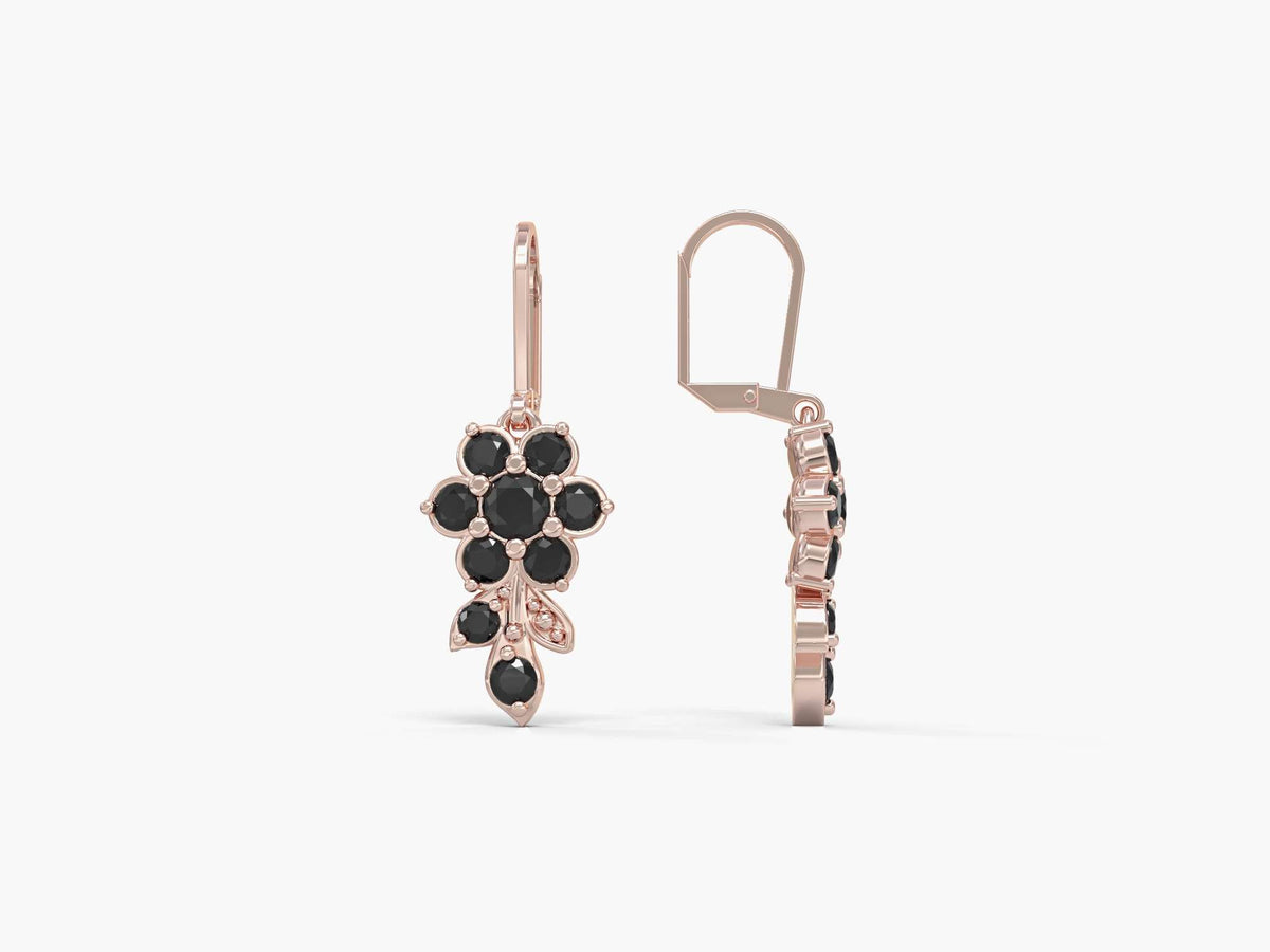 Earrings hanging from a short flowering branch studded with zircons