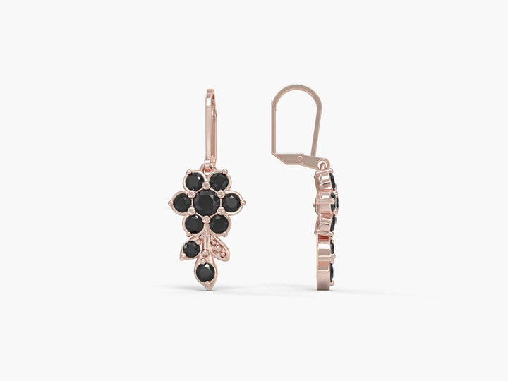 Earrings hanging from a short flowering branch studded with zircons