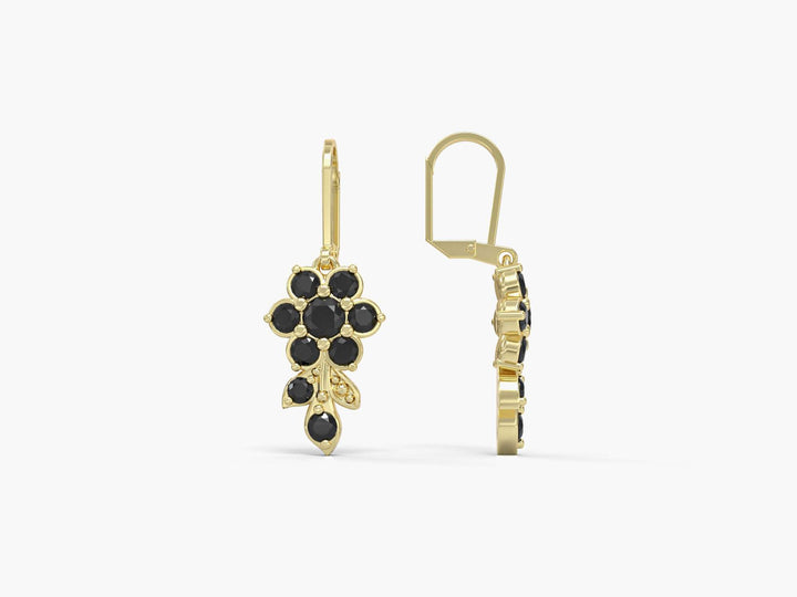 Earrings hanging from a short flowering branch studded with zircons