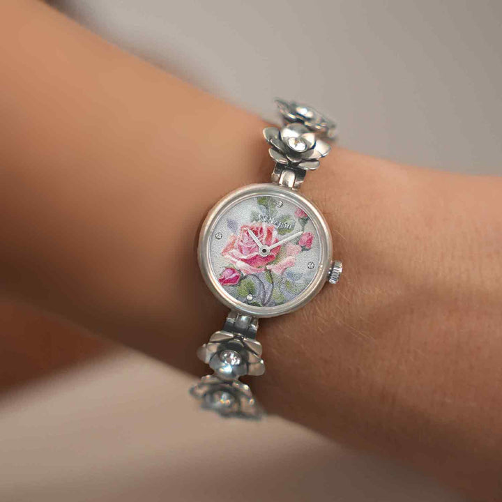 Women's wristwatch with a floral bracelet design and inlaid rhodium plating 