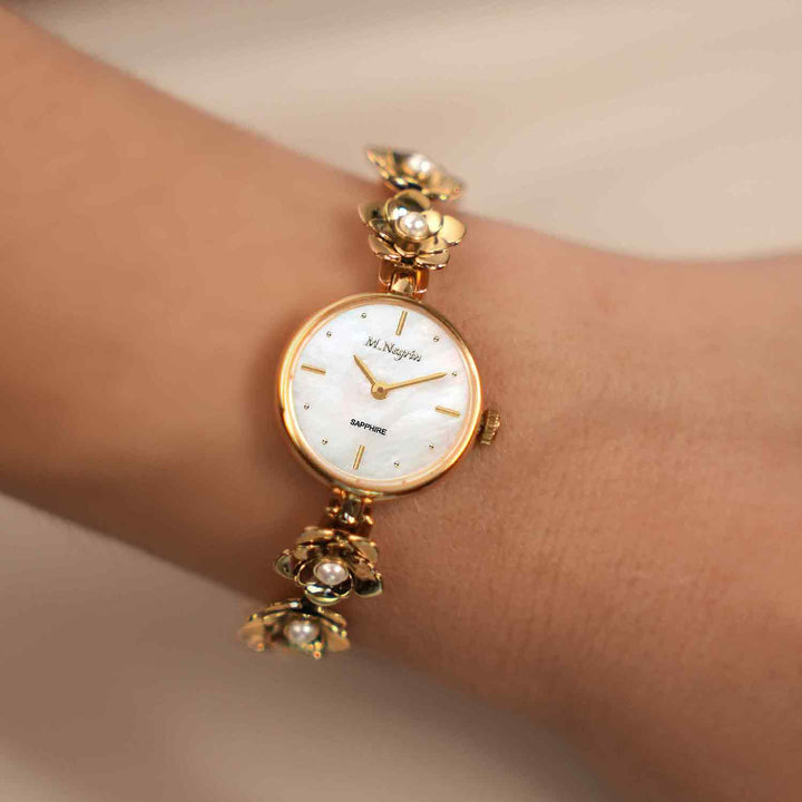 Women's wristwatch with a gold-plated pearl-studded flower bracelet design 