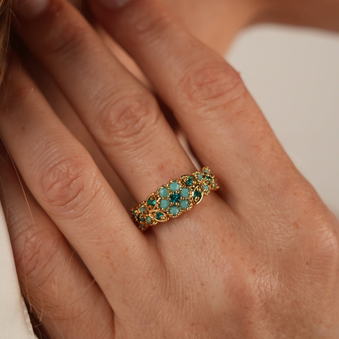 18K gold-plated ring with flowers inlaid with turquoise stones Volver 