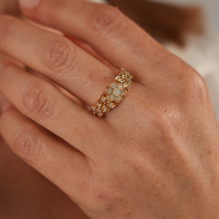 18K gold-plated ring with flowers inlaid with synthetic opal stones Volver 
