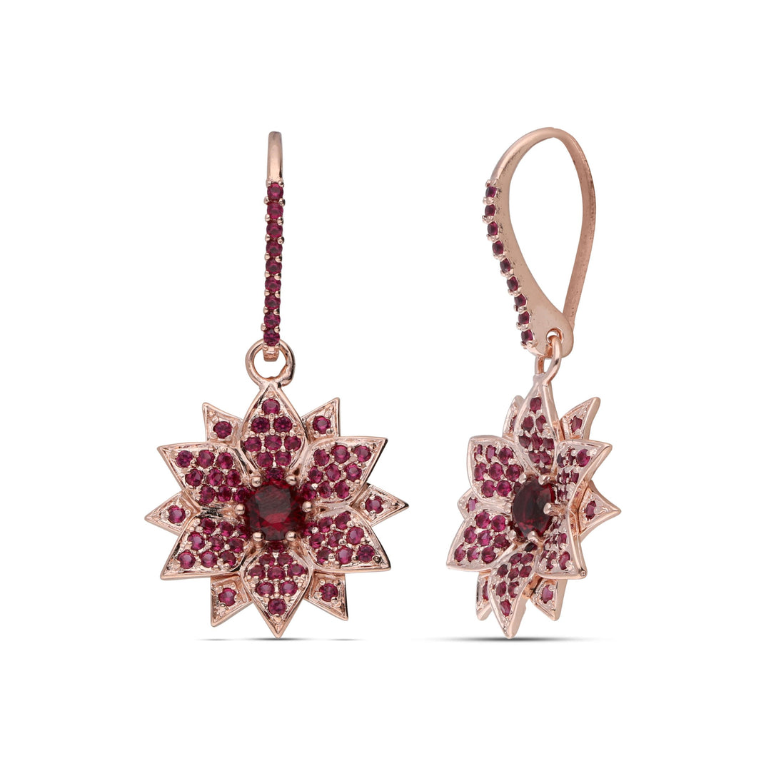Amaryllis dangling earrings studded with ruby ​​colored crystal stones
