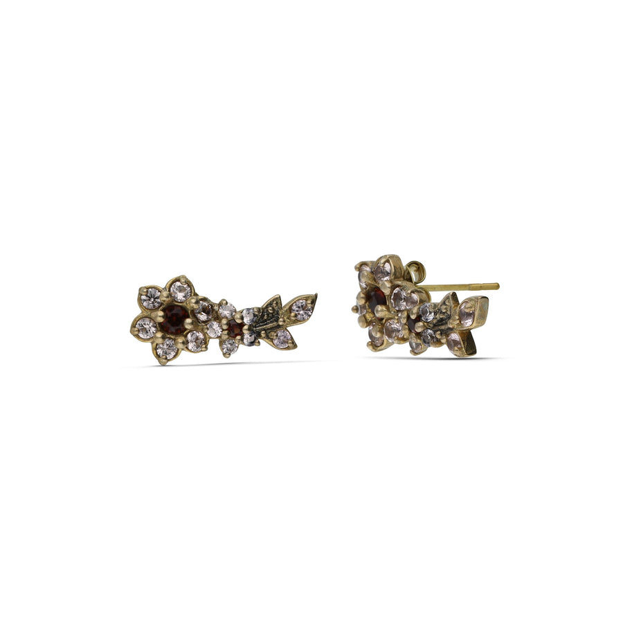 Close-up earrings, the sounds of flowers, are studded with cream garnet colored crystals