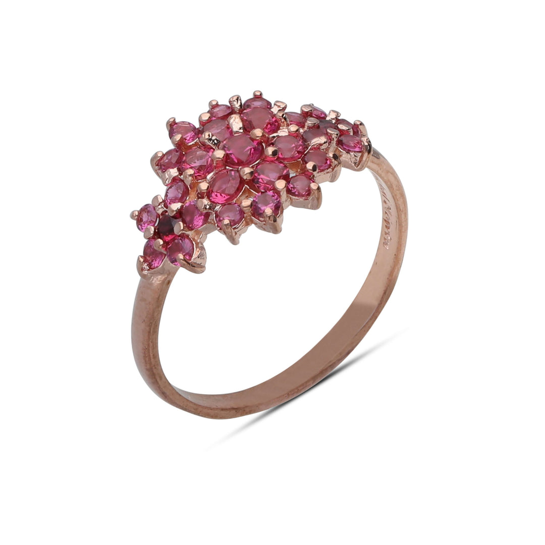 A floral rhombus ring studded with ruby ​​colored crystal stones