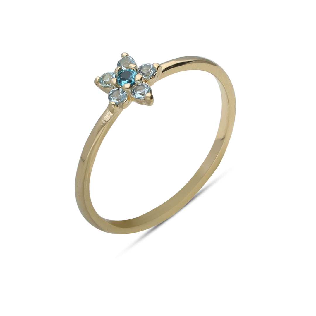 A single flower ring studded with turquoise colored crystal stones