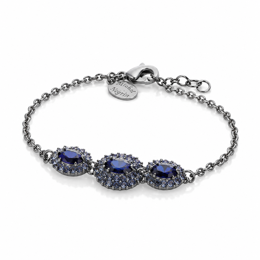 A marquise-shaped eye bracelet studded with blue crystal stones