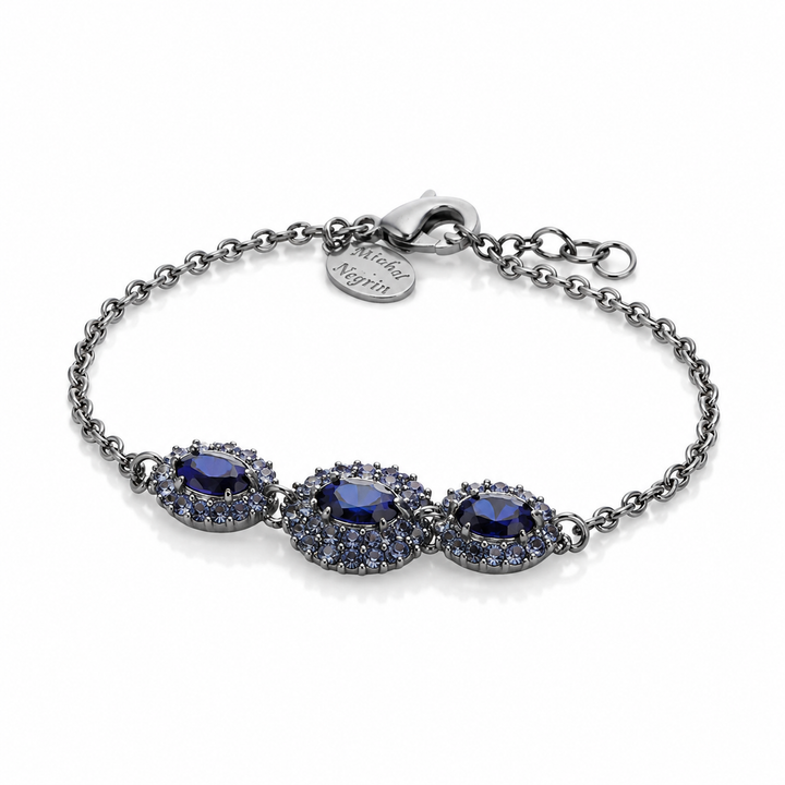 A marquise-shaped eye bracelet studded with blue crystal stones
