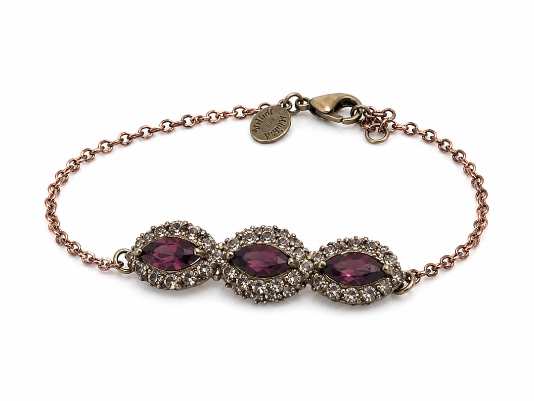 An eye bracelet in the form of a marquise inlaid with colored Cream Grant  crystal stones