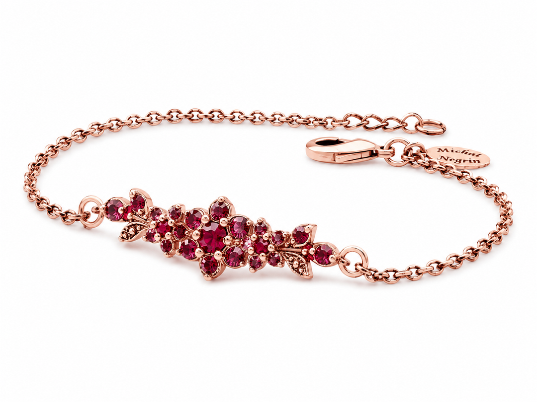 A medium flowering branch bracelet studded with ruby colored crystal stones