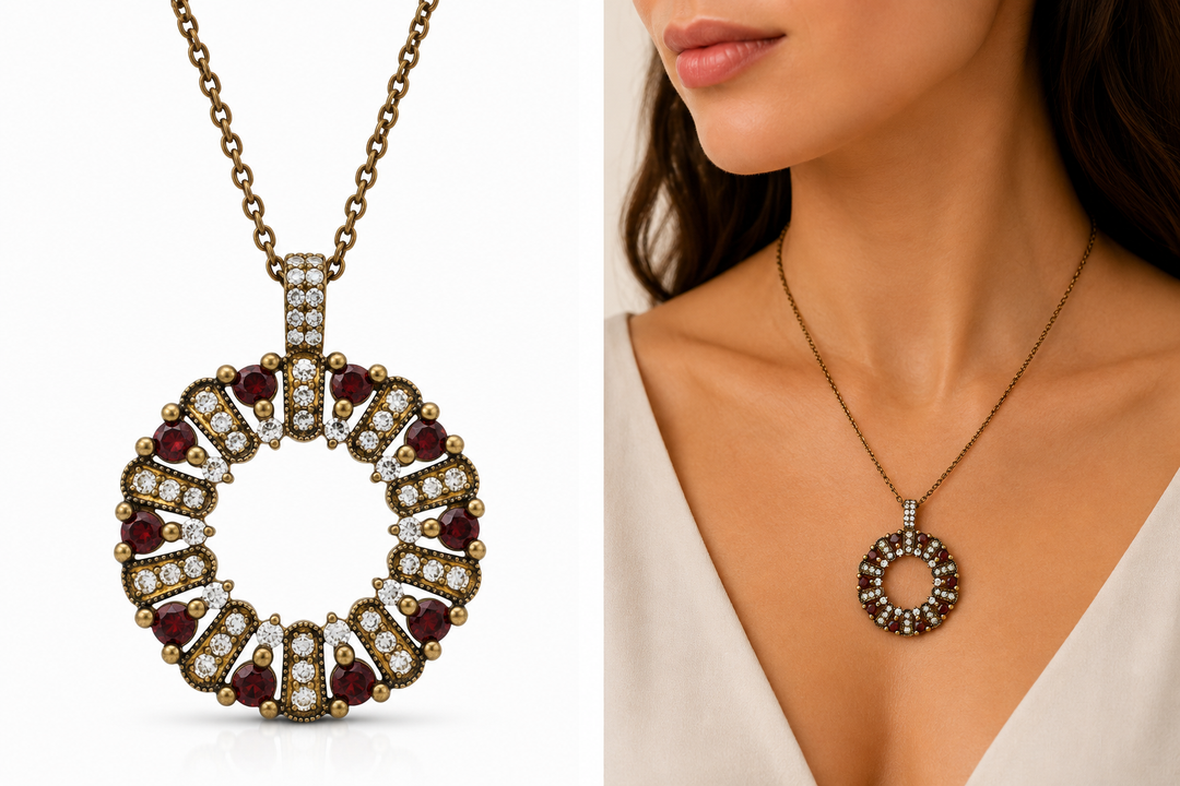 The circle of life necklace is studded with cream garnet colored crystals