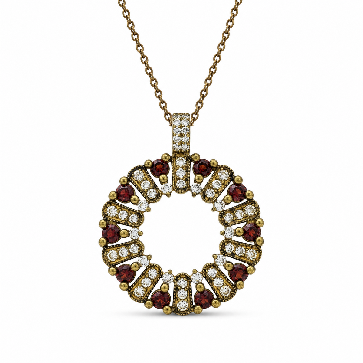 The circle of life necklace is studded with cream garnet colored crystals