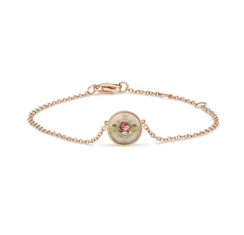 Gold bracelet with a pink rose