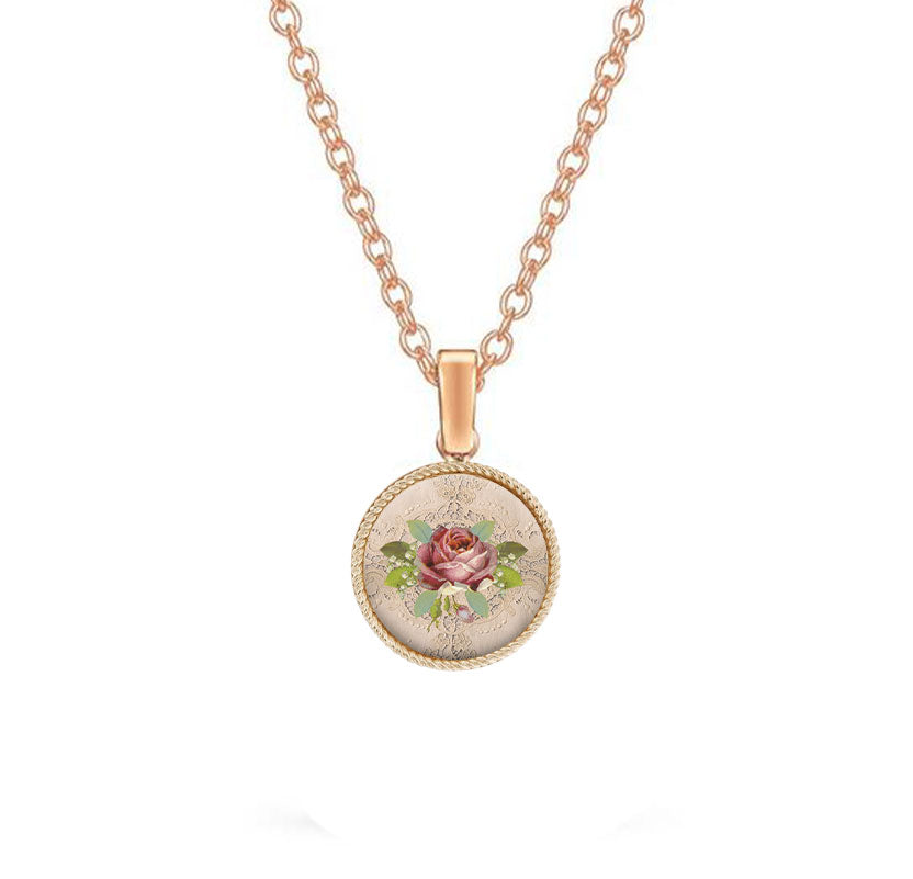 Gold pendant with a pink rose